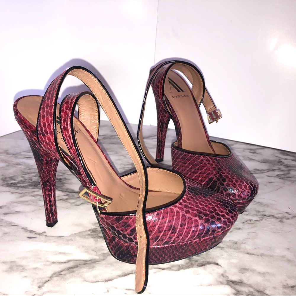 Red snakeskin pumps